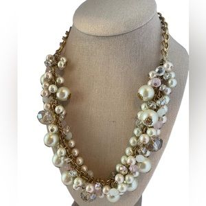 Gold tone with faux white pearls and faux clear and pink.